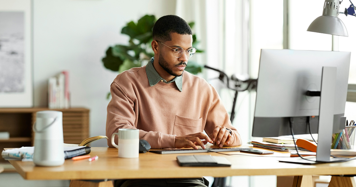 man thinking at computer
